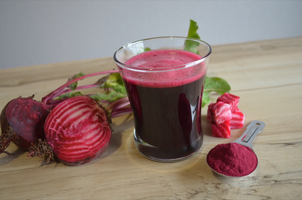 Beet juice and beet root powder beside fresh beets